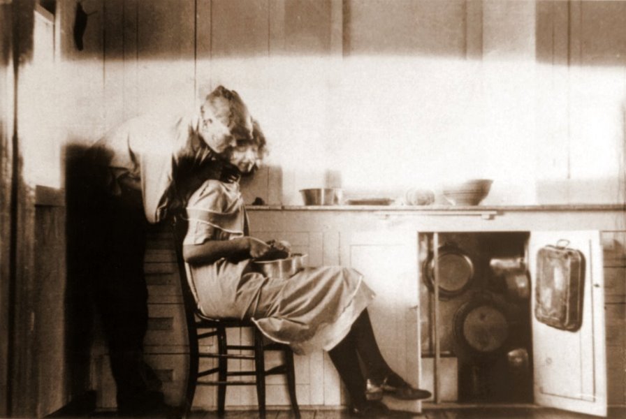 A tender moment in the kitchen, 1925